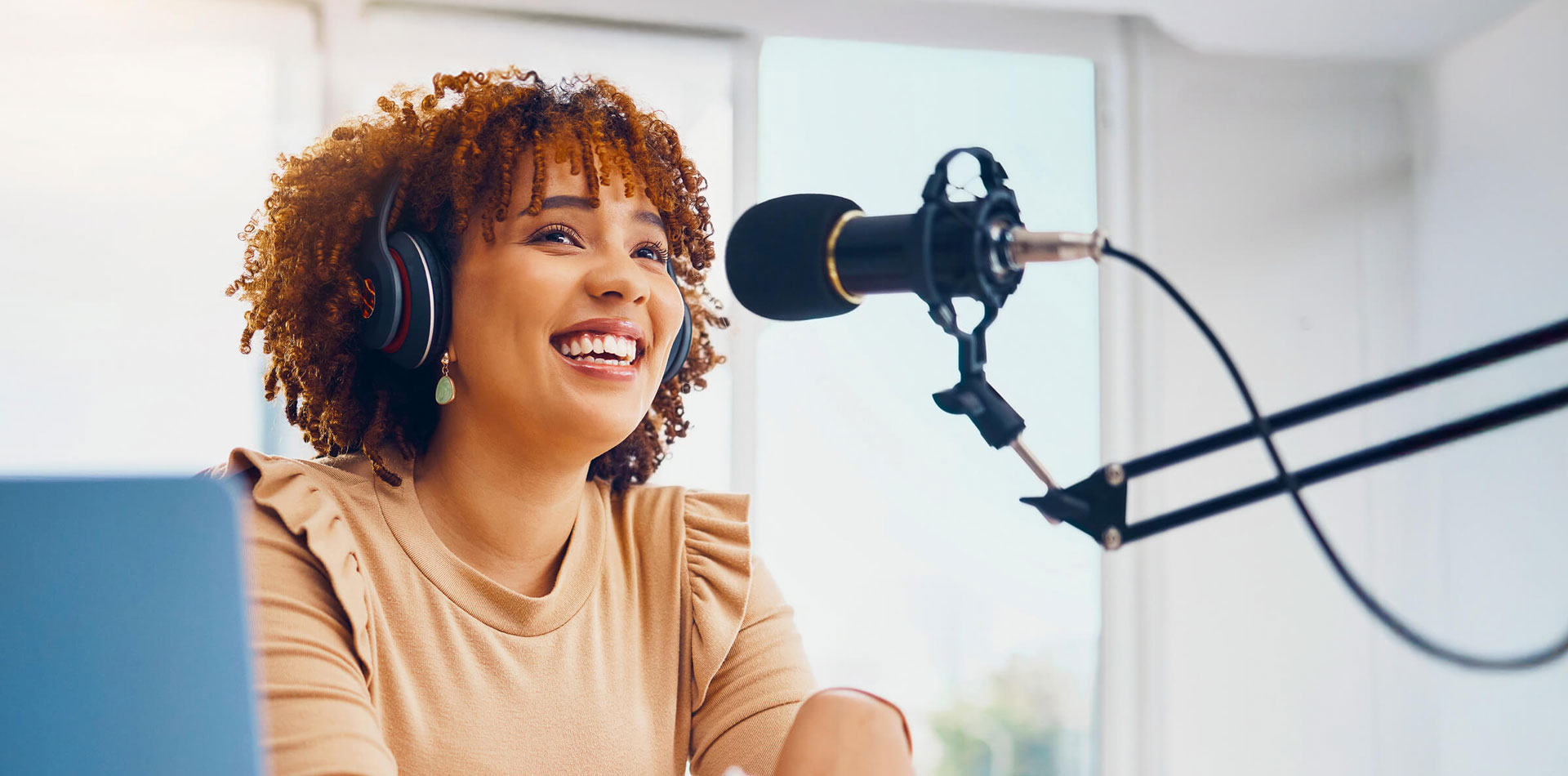 Regent University student at a microphone